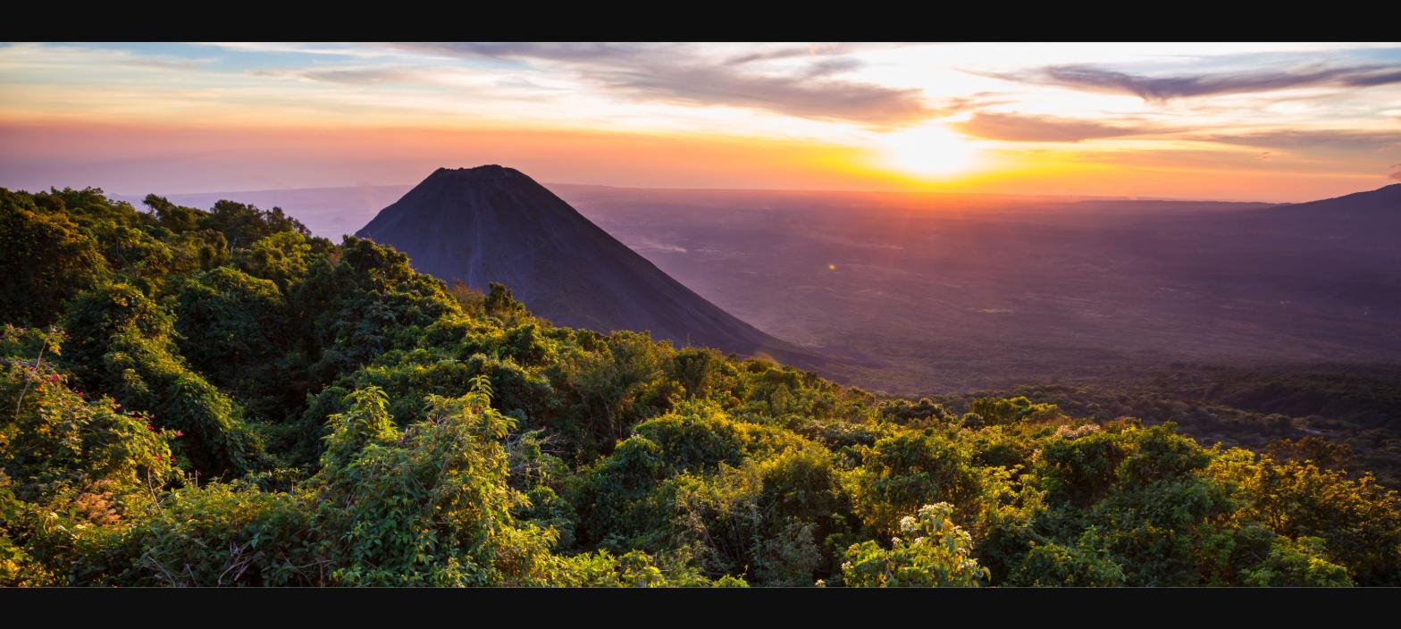 Izalco Volcano at sunset surrounded by tropical forest, El Salvador - Montano & Company